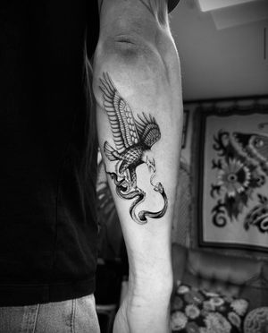 Stunning tattoo design featuring a snake and eagle by the talented artist Georgina. Perfect for those who love intricate illustrative ink.