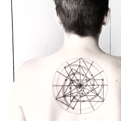Mesmerizing blackwork tattoo by Malvina Maria Wisniewska, featuring a stunning geometric pattern design.
