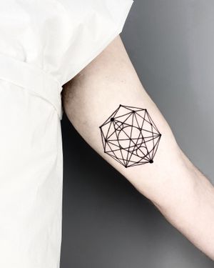 Discover the intricate beauty of geometric patterns with this fine line tattoo by Malvina Maria Wisniewska.