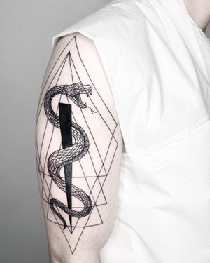 Explore the intricate beauty of blackwork with this fine line geometric snake tattoo by Malvina Maria Wisniewska.