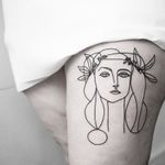 Experience the artistry of Malvina Maria Wisniewska with this fine line illustrative tattoo of a beautiful woman.