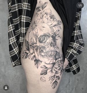 Experience the beauty of nature and the intrigue of death with this stunning floral skull tattoo designed by Kayla. A perfect blend of elegance and edge.