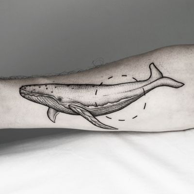 Embrace the beauty of the deep with this stunning blackwork whale tattoo, combining geometric and illustrative elements by the talented artist Malvina Maria Wisniewska.