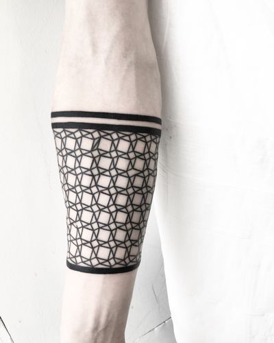 Embrace the precision and beauty of geometric blackwork with this stunning pattern tattoo by Malvina Maria Wisniewska.