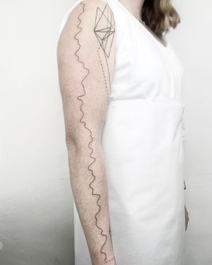 Elegant fine line tattoo featuring abstract wavy motifs by Malvina Maria Wisniewska.