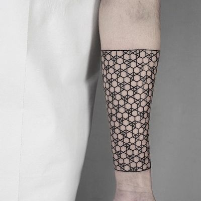 Unique geometric tattoo design by artist Malvina Maria Wisniewska, showcasing a captivating pattern motif.
