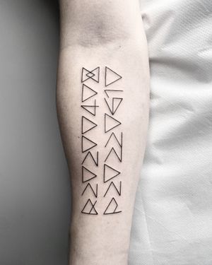 Adorn your skin with a fine line, geometric symbol by Malvina Maria Wisniewska. Perfect for minimalistic tattoo lovers.