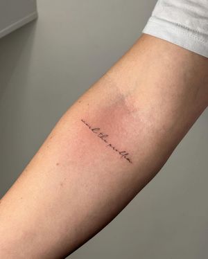Get a delicate and elegant tattoo with small lettering, expertly done by Amelia in fine line style for a minimalist look.