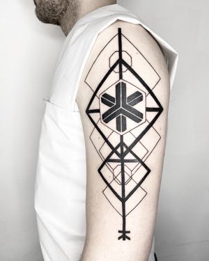 Discover the intricate beauty of blackwork design with this geometric pattern tattoo by artist Malvina Maria Wisniewska.