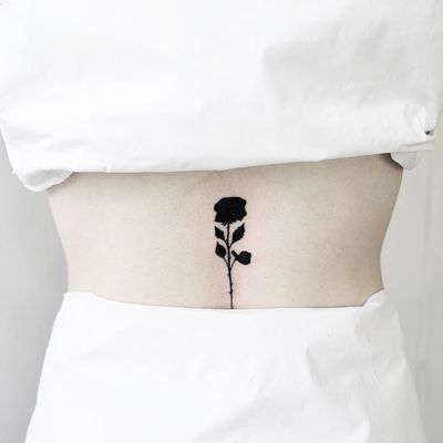 Get a stunning rose tattoo in fullblack style by the talented artist Malvina Maria Wisniewska.