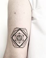 Unique blackwork tattoo by Malvina Maria Wisniewska featuring intricate geometric patterns in abstract design.