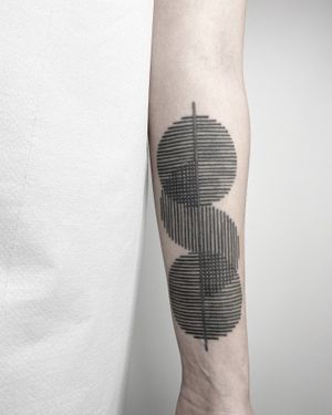 This stunning blackwork tattoo by Malvina Maria Wisniewska features a mesmerizing geometric pattern inspired by intricate embroidery designs.