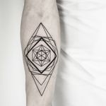 Elegant and intricate blackwork tattoo featuring geometric patterns created by Malvina Maria Wisniewska.