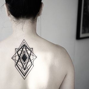 Explore the intricate beauty of geometric blackwork with this stunning pattern tattoo by the talented artist Malvina Wisniewska.