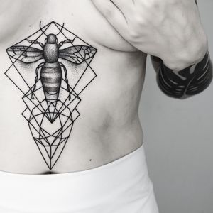 Unique black and gray tattoo combining dotwork, fine line, and geometric elements, skillfully created by Malvina Maria Wisniewska.