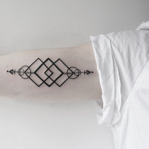 Embrace the precision and uniqueness of Malvina Maria Wisniewska's breathtaking blackwork geometric tattoo design.