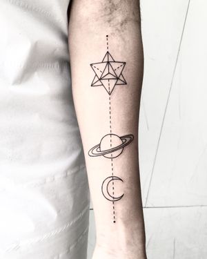 Get a stunning fine line tattoo of a planet designed by Malvina Maria Wisniewska, showcasing her expertise in geometric artistry.