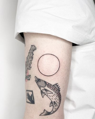 A stunning fine line and geometric tattoo of a circle by Malvina Maria Wisniewska.