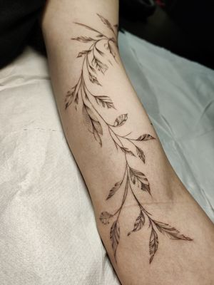 Elegant fine line floral design featuring a beautiful plant sprig, done by the talented artist Mary Shalla.