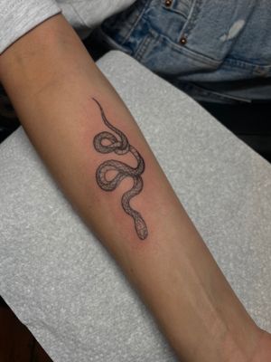 Bring the fierce and mysterious energy of a snake to life with this illustrative tattoo by the talented artist Julia Bertholdi.