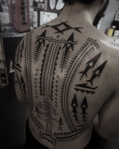 Elegant and bold blackwork tribal pattern tattoo created by Francesco Capro. A stunning blend of tradition and contemporary style.