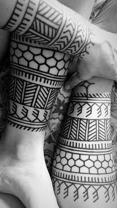 Get mesmerized by Francesco Capro's tribal-inspired pattern tattoo, perfect for those who love bold and intricate designs.