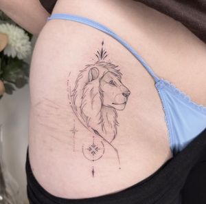 Fine line and illustrative tattoo by Lucas Scardua, featuring a geometric lion design to cover a scar