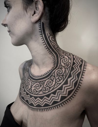 Exquisite blackwork tribal design by Francesco Capro, showcasing intricate patterns and bold lines. Perfect for those seeking a unique and bold tattoo.
