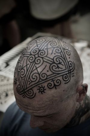 Explore the mesmerizing world of patterns with this ornamental tattoo by Francesco Capro. Adorn your body with stunning symmetry and precision.