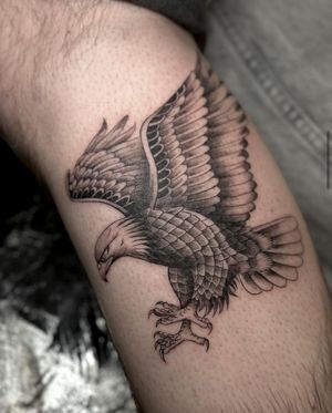 Experience the fierce beauty of this illustrative eagle tattoo by Maddie. Perfect for nature lovers and those who value strength and power.