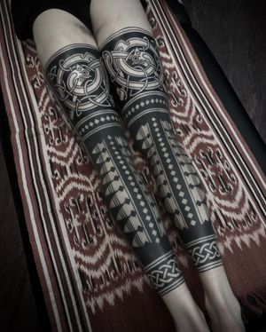 Unique ornamental tattoo featuring a striking blackwork tribal pattern designed by Francesco Capro.