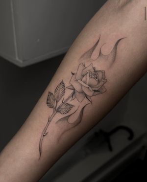 Get a stunning black and gray fine line rose tattoo by the talented artist Maddie. Perfect for floral tattoo lovers!