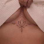 Fine line ornamental tattoo by Lucas Scardua featuring a delicate and dainty lotus motif.