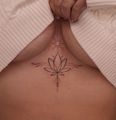 Fine line ornamental tattoo by Lucas Scardua featuring a delicate and dainty lotus motif.