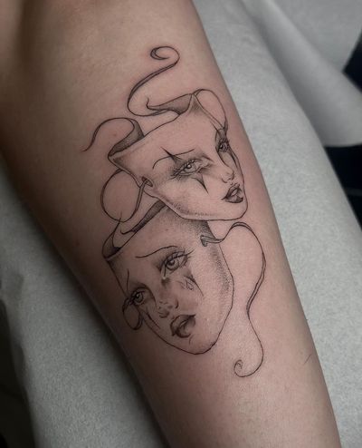 Experience the fine line and illustrative style of Maddie's theatric mask tattoo design. Perfect for those who love theatrical motifs.
