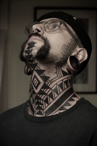 Discover the mesmerizing beauty of this ornamental tattoo by Francesco Capro, featuring a stunning blackwork tribal pattern.