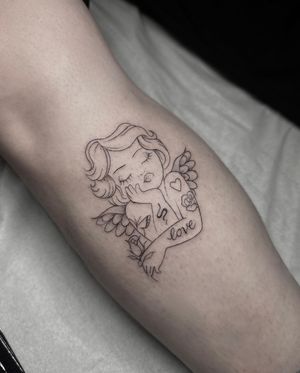 Capture the ethereal beauty of an angel with this delicate fine line and illustrative tattoo by the talented artist Maddie.