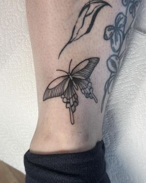Adorn your skin with an illustrative butterfly tattoo by the talented artist Rachael Flowers. Fly away with stunning artistry!