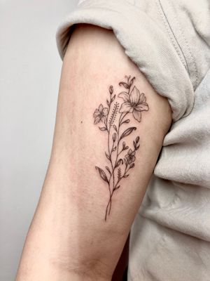 Experience delicate beauty with this fine line floral tattoo of a stunning flower, expertly crafted by the talented artist Gee.