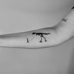 Get inked with a badass blackwork dinosaur cowboy tattoo by Ruth Hall. A unique and fierce illustrative design.