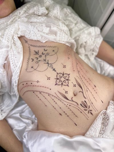 Elegant and intricate dotwork design featuring delicate ornamental patterns, created by the talented artist Viví Bogdanov.