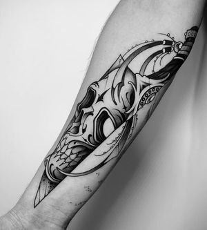 Get inked with this striking illustrative tattoo featuring a skull and dagger by Gabriele Lacerenza. Perfect for a bold and edgy look!