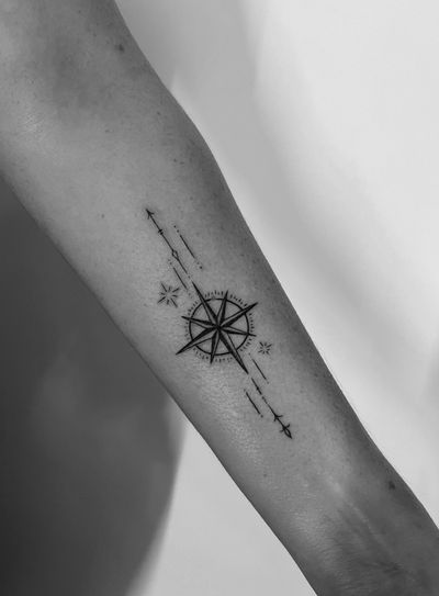 Fine line and illustrative compass design by Gabriele Lacerenza. Perfect for those seeking a modern and intricate tattoo.