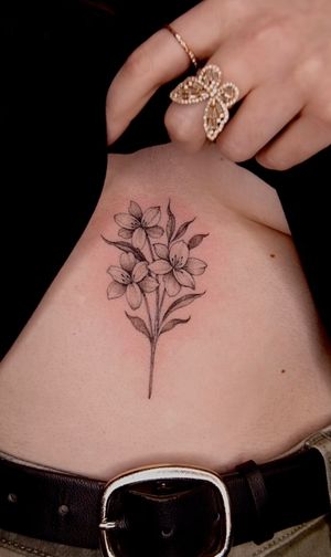 Delicate lilies on the sternum