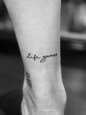 Get a small lettering tattoo by Gabriele Lacerenza for a simple and elegant look that will stand the test of time.