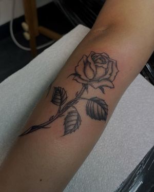 Elegant and detailed illustrative rose tattoo by artist Julia Bertholdi, perfect for adding a touch of beauty to your skin.