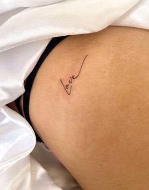 Discover the delicate artistry of small lettering by Gabriela in this fine line tattoo design. Perfect for those seeking a minimalist yet impactful piece.