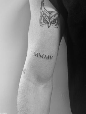 Get a beautifully crafted small lettering tattoo by Gabriele Lacerenza for a subtle yet meaningful addition to your body art collection.
