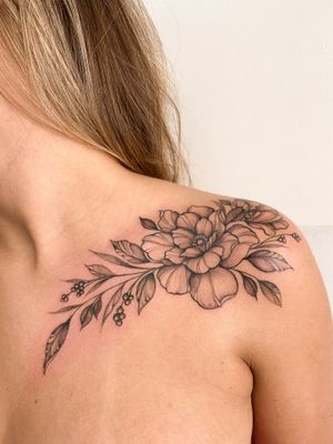 Get a beautifully detailed illustrative floral tattoo of a stunning flower designed by talented artist Gabriela.