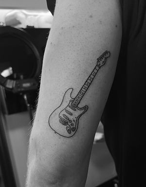 Illustrative tattoo by Gabriele Lacerenza featuring a detailed fender electric guitar design.